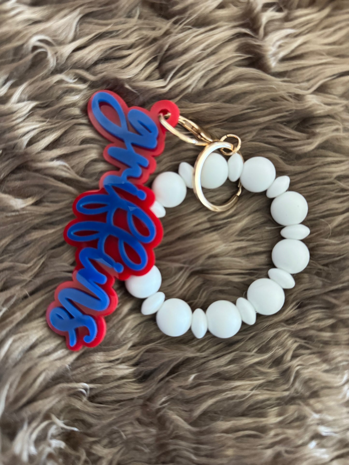 White Wristlet with Griffins Keychain